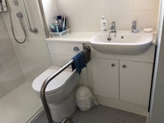 Toilet with Hand Rail