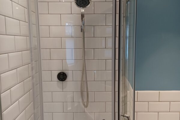 Metro white tiles and Mira shower