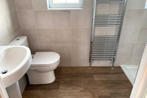 Tiles bathroom with chrome towel rail