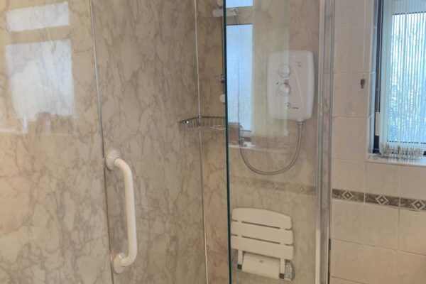Walk in shower with wet wall panels